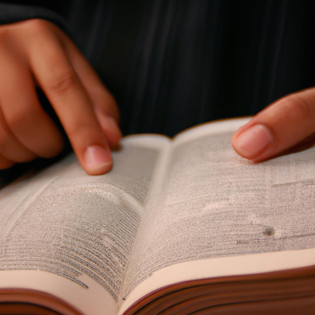 Person holding dictionary, reading it